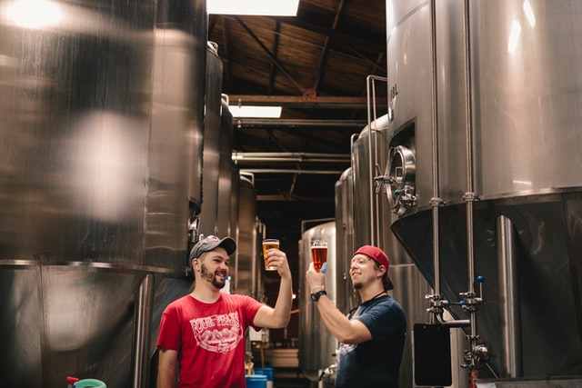 Craft Brewery Marketing Tips; two men enjoying their craft beer