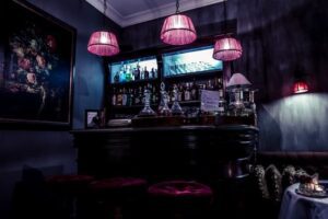 a speakeasy vibe inside a dimly-lit bar