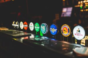 pub improvements for 2022; Alcohol brands highlighted on a bar counter.