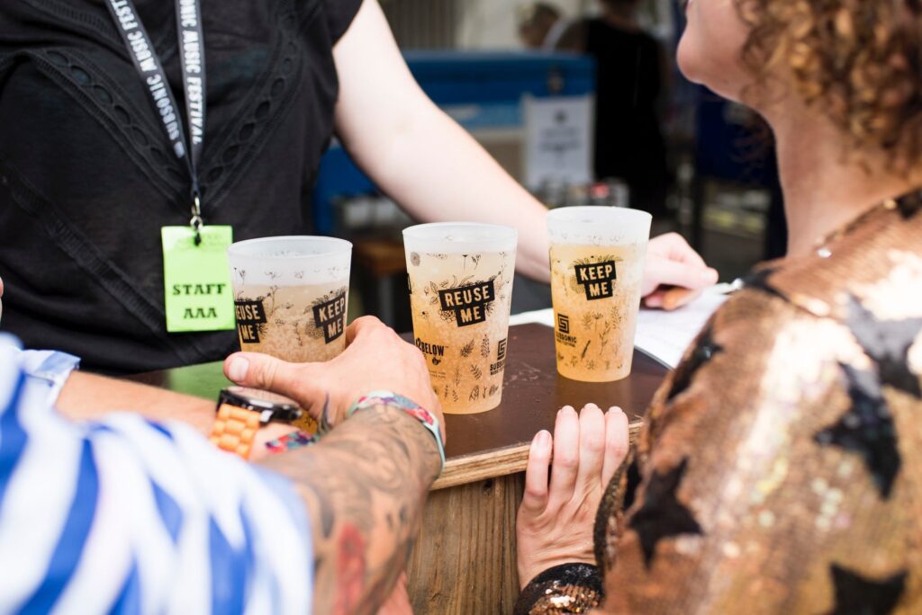 Best Beer Festivals 2022; people picking up beers in glasses from a counter