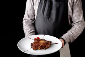 restaurant promotion offers; waiter serving steak