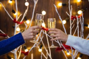 pub promotion for the holidays; cheers with a glass of champagne