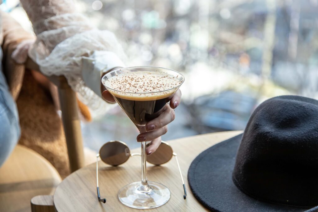 Valentine’s day drinks, person holding a chocolate martini glass.
