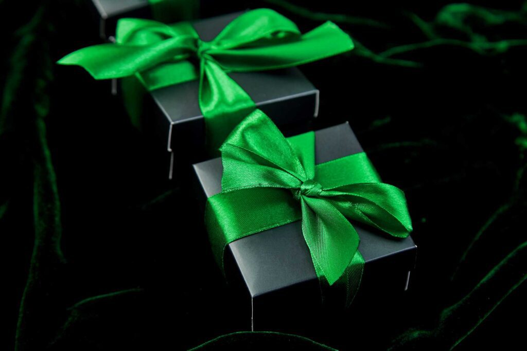 luxury box packaging; a black box with a green ribbon