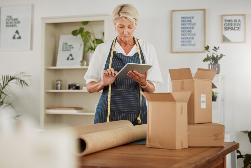 a woman checking packaging materials