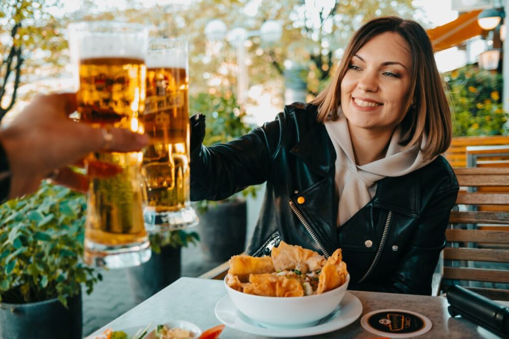 oktoberfest 2023: a woman enjoying a glass of beer