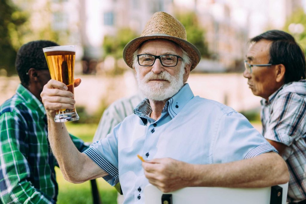 father's day tradition, old man holding up beer